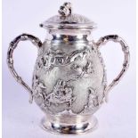 A 19TH CENTURY TWIN HANDLED SILVER VASE AND COVER decorated with figures in landscapes. 149 grams.