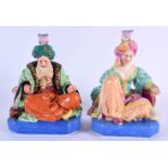 A PAIR OF 19TH CENTURY FRENCH JACOB PETIT SCENT BOTTLES AND STOPPERS formed as a seated Sultans.