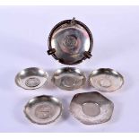 TWO ANTIQUE CHINESE SILVER COIN DISHES together with four English silver coin dishes. 368 grams.