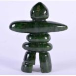 AN UNUSUAL TRIBAL CARVED JADE STANDING IDOL possibly North American and inuit. 8 cm x 6.5 cm.