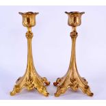 A PAIR OF EUROPEAN ART NOUVEAU CANDLESTICKS possibly gilt bronze, signed JB. 21 cm x 9 cm.