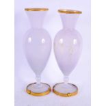 A PAIR OF EARLY 20TH CENTURY FRENCH OPALINE GLASS VASES mounted with gilt shells. 23 cm high.