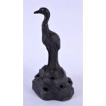 A RARE WEDGWOOD BLACK BASALT STORK BIRD modelled upon a rocky outcrop. 17 cm high.