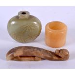 A CHINESE JADE SNUFF BOTTLE together with a belt hook and archers ring. Largest 8.25 cm long. (3)