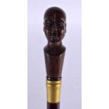 A PHRENOLOGY HEAD WALKING CANE. 90 cm long.