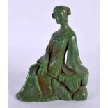 A CHINESE CARVED GREEN JADE TYPE FIGURE OF A FEMALE 20th Century, modelled upon a rock. 15 cm x 10