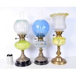 A collection of antique oil lamps two with etched glass shades. 56 cm (3).
