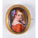 AN ANTIQUE YELLOW METAL AND PORCELAIN BROOCH. 13.5 grams. 5 cm x 4.25 cm.