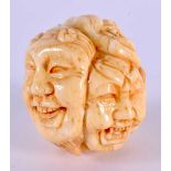 A JAPANESE CARVED BONE MASK HEAD NETSUKE. 4.5 cm x 3.5 cm.