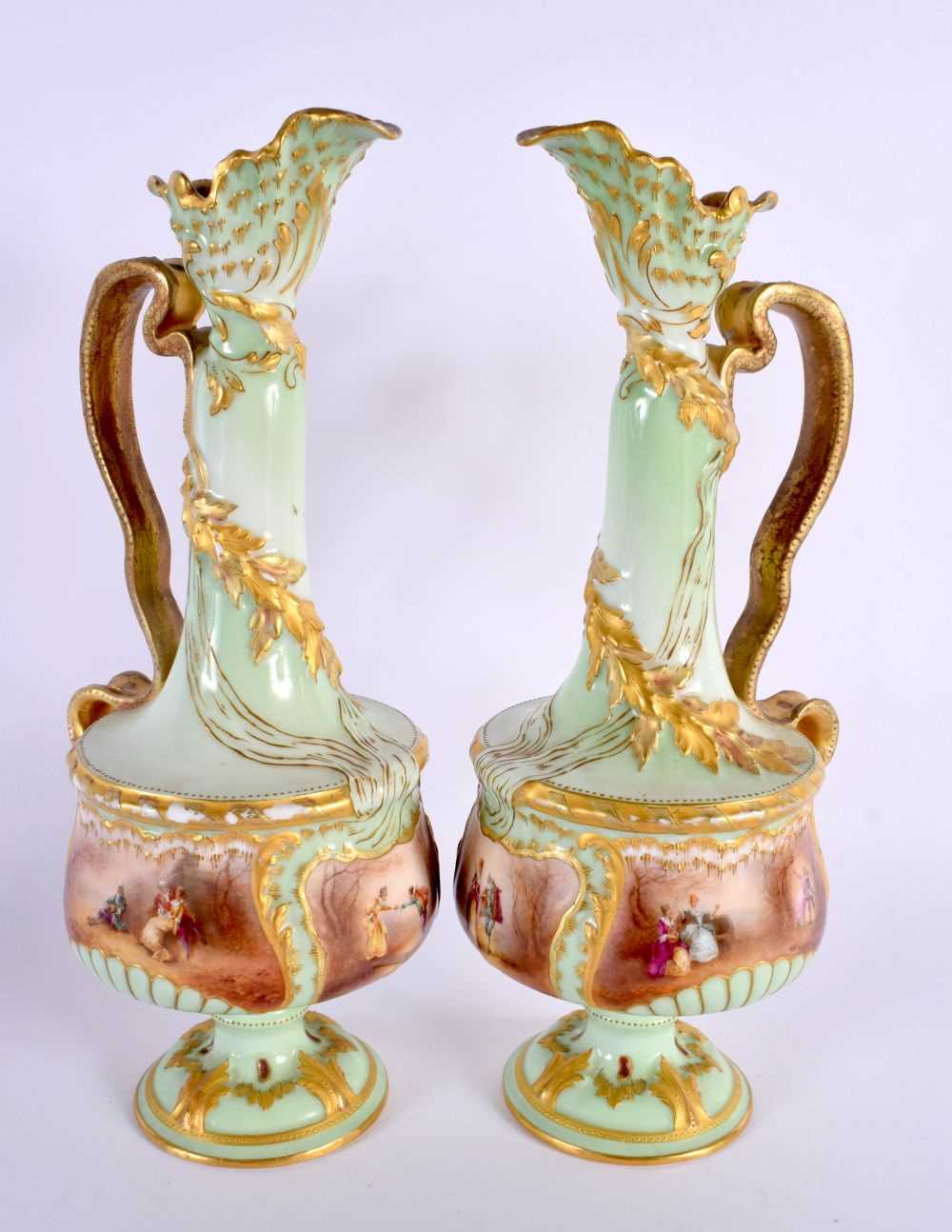 A PAIR OF ANTIQUE FRENCH LIMOGES PORCELAIN EWER painted with figures in a landscape upon a green - Image 2 of 6