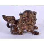 A JAPANESE CARVED BOXWOOD LION NETSUKE. 5 cm x 3 cm.