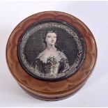 AN ANTIQUE CARVED HORN SNUFF BOX. 6.5 cm diameter.