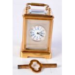 A MINIATURE CARRIAGE CLOCK. 7.75 cm x 4 cm.