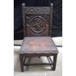 A carved Welsh oak chair inscribed John Elkington Llangollen Jan 1879 also stamped on seat 1868 79 x