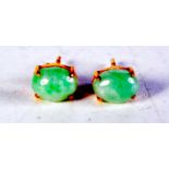 A PAIR OF 18CT GOLD AND JADEITE EARRINGS. 1.5 grams. 0.75 cm x 0.5 cm.