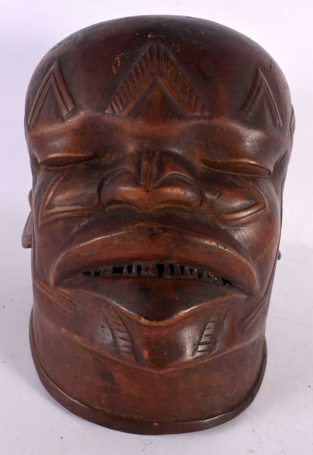 A GOOD EARLY 20TH CENTURY AFRICAN TRIBAL MAKONDE LIPIKO WOOD MASK used by an elder to celebrate