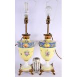 A PAIR OF EARLY 20TH CENTURY CONTINENTAL PORCELAIN LAMPS painted with foliage and landscapes. 55