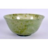 AN EARLY 20TH CENTURY CHINESE CARVED JADEITE BOWL Late Qing/Republic. 12.5 cm diameter.