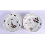 18th century pair of Meissen plates painted with a large bouquet and scattered flowers, crossed