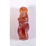 A MIDDLE EASTERN CARVED AGATE FIGURAL TOGGLES. 5 cm x 1.5 cm.