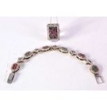 A SILVER GEM SET BRACELET with matching ring. Ring N. 47 grams. Largest 21 cm long. (2)