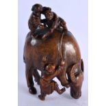 AN 18TH/19TH CENTURY CHINESE CARVED BAMBOO BULLOCK Qing, overlaid with young boys. 20 cm x 12 cm.