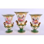 AN EARLY 19TH CENTURY ENGLISH PORCELAIN GARNITURE OF VASES painted with flowers. Largest 19 cm x