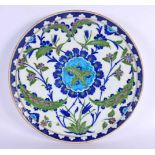 A LARGE TURKISH OTTOMAN IZNIK PLATE painted with flowers. 30 cm diameter.