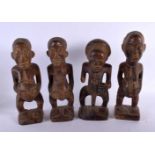 FOUR AFRICAN TRIBAL CARVED WOOD FIGURES. 29 cm high. (4)