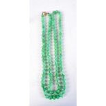 A 14CT GOLD AND JADEITE NECKLACE. 288 grams. 140 cm long.