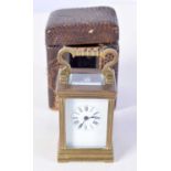 A MINIATURE ANTIQUE CARRIAGE CLOCK. 7.75 cm x 4 cm.