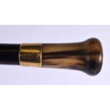 AN ANTIQUE 18CT GOLD CARVED BUFFALO HORN WALKING CANE. 90 cm long.
