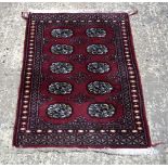 A Small Bokhara prayer rug 97 x 56 cm.