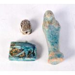 An Egyptian blue glazed pottery shabti, together with two other items. Largest 10.5 cm. (3)