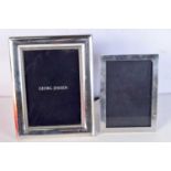 THREE SILVER PHOTOGRAPH FRAMES. 813 grams overall. Largest 23.5 cm x 19 cm. (3)