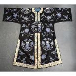 AN UNUSUAL LATE 19TH CENTURY CHINESE MIDNIGHT BLUE SILK EMBROIDERED ROBE Qing, decorated with