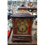 A LARGE ANTIQUE FAUX TORTOISESHELL LACQUERED BRACKET CLOCK ON BELLS with matching bracket. Clock