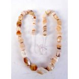 A carved agate necklace 66cm.