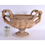 A LARGE 19TH CENTURY ITALIAN GRAND TOUR CARVED ALABASTER URN decorated with mask heads and