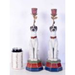 A pair of porcelain dog candle stick holders 34 cm (2).
