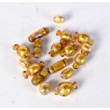 A collection of gold coloured glass beads. (qty)