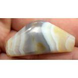An agate Zhu bead, together with two other articles. (3)