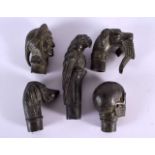 FIVE CONTEMPORARY BRONZE WALKING CANE HANDLES. Largest 9 cm long. (5)