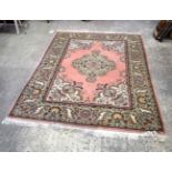 An Oriental rug 240 x 168 cm.