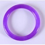 A CHINESE CARVED LAVENDER JADE BANGLE 20th Century. 8 cm diameter.