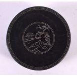 A CHINESE CARVED INK BLOCK AND COVER 20th Century. 9.5 cm diameter.