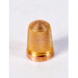 A 9CT GOLD THIMBLE. 4.2 grams. 2 cm x 1.75 cm.