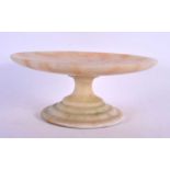 AN EARLY 20TH CENTURY EUROPEAN CARVED ALABASTER TAZZA upon a stepped base. 24 cm diameter.