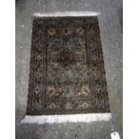 A small silk rug. 92 x 61cm.