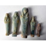 A group of Egyptian glazed pottery Sarcophagus figures. Largest 15cm (5).